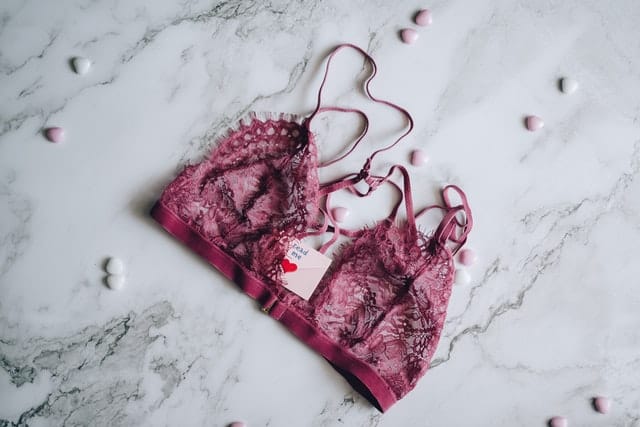 Red lace bra on marble floor