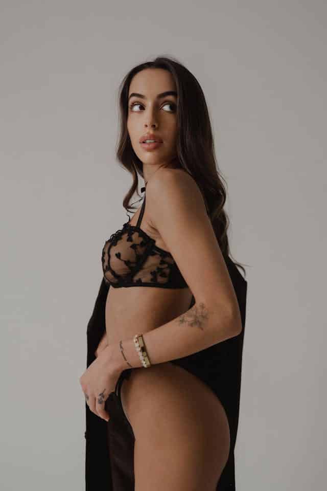 a woman in a sexy black lace lingerie brands